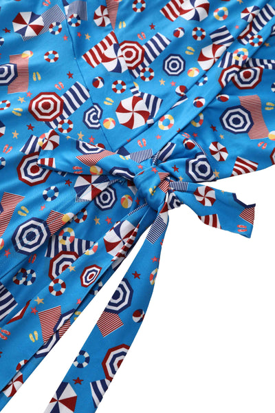The tie strap of Matilda Wrap Dress In Blue Parasole Print