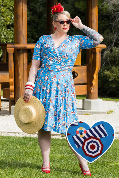 A model wearing a Matilda Wrap Dress In Blue Parasol Print