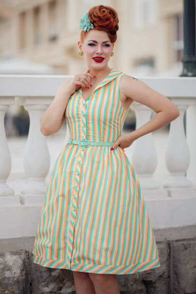 A model wearing a Yellow Striped Shirt Dress