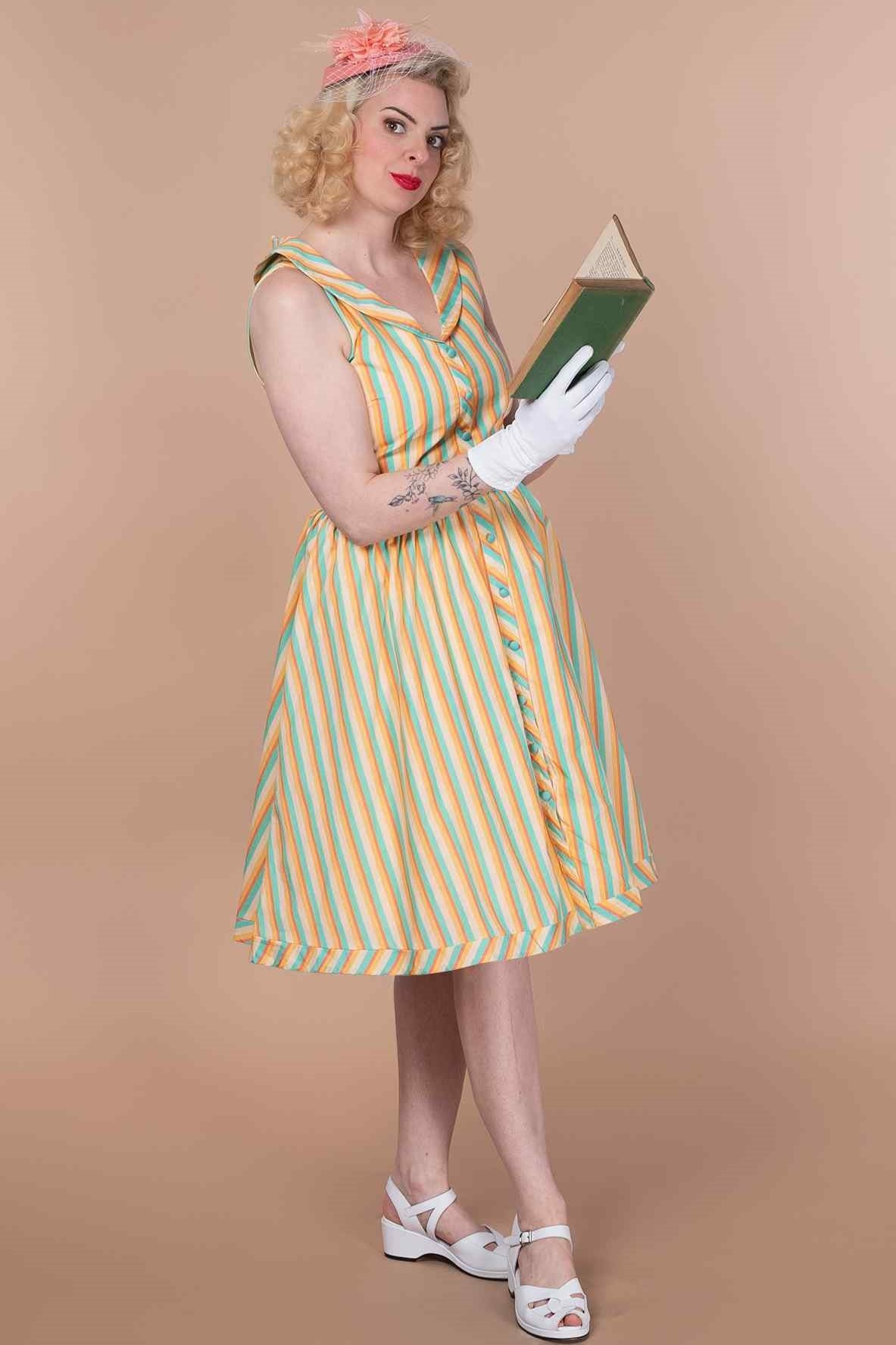 A model wearing a Yellow Striped Shirt Dress