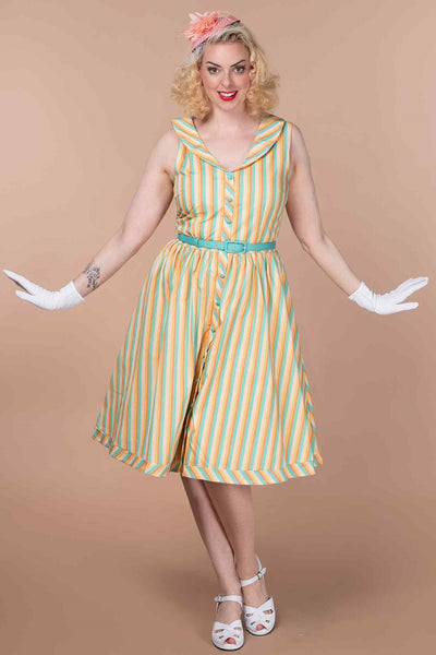 A model wearing a Yellow Striped Shirt Dress