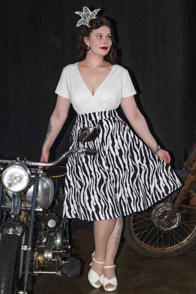 A lady wearing a Zebra Print Swing Skirt