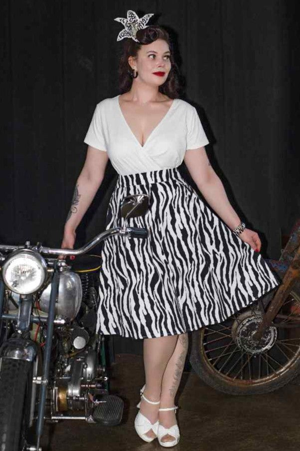 A lady wearing a Zebra Print Swing Skirt