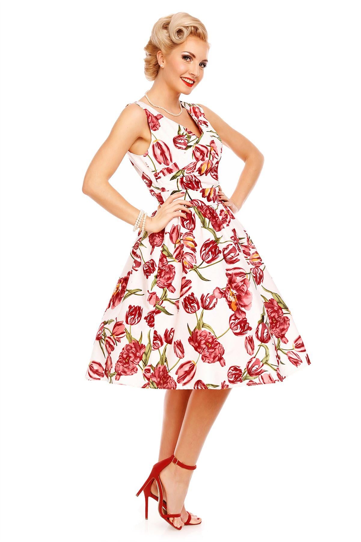 Model wearing our V neck May dress, in white, with pink tulips, side view