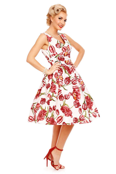 Model wearing our V neck May dress, in white, with pink tulips, side view
