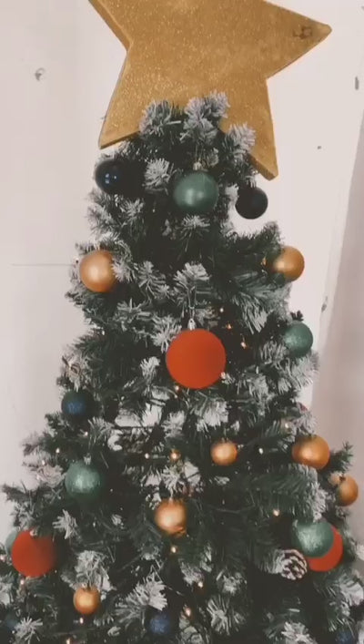 Video of blogger wearing our sleeveless Poppy button up dress in green tartan print, whilst decorating a Christmas tree and twirling around