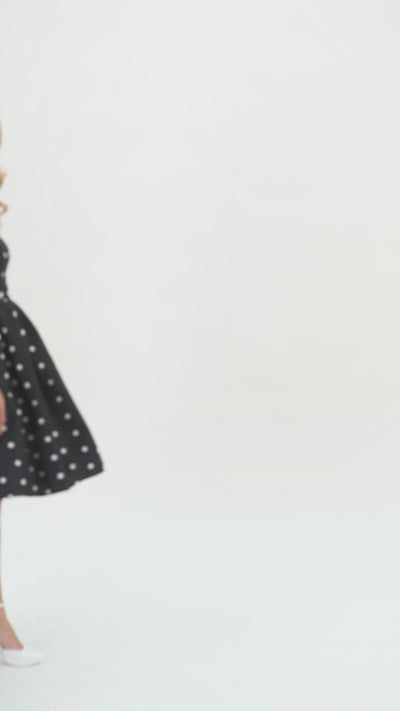 Video of a model wearing our Annie Retro Polka Dot Dress In Black-White.