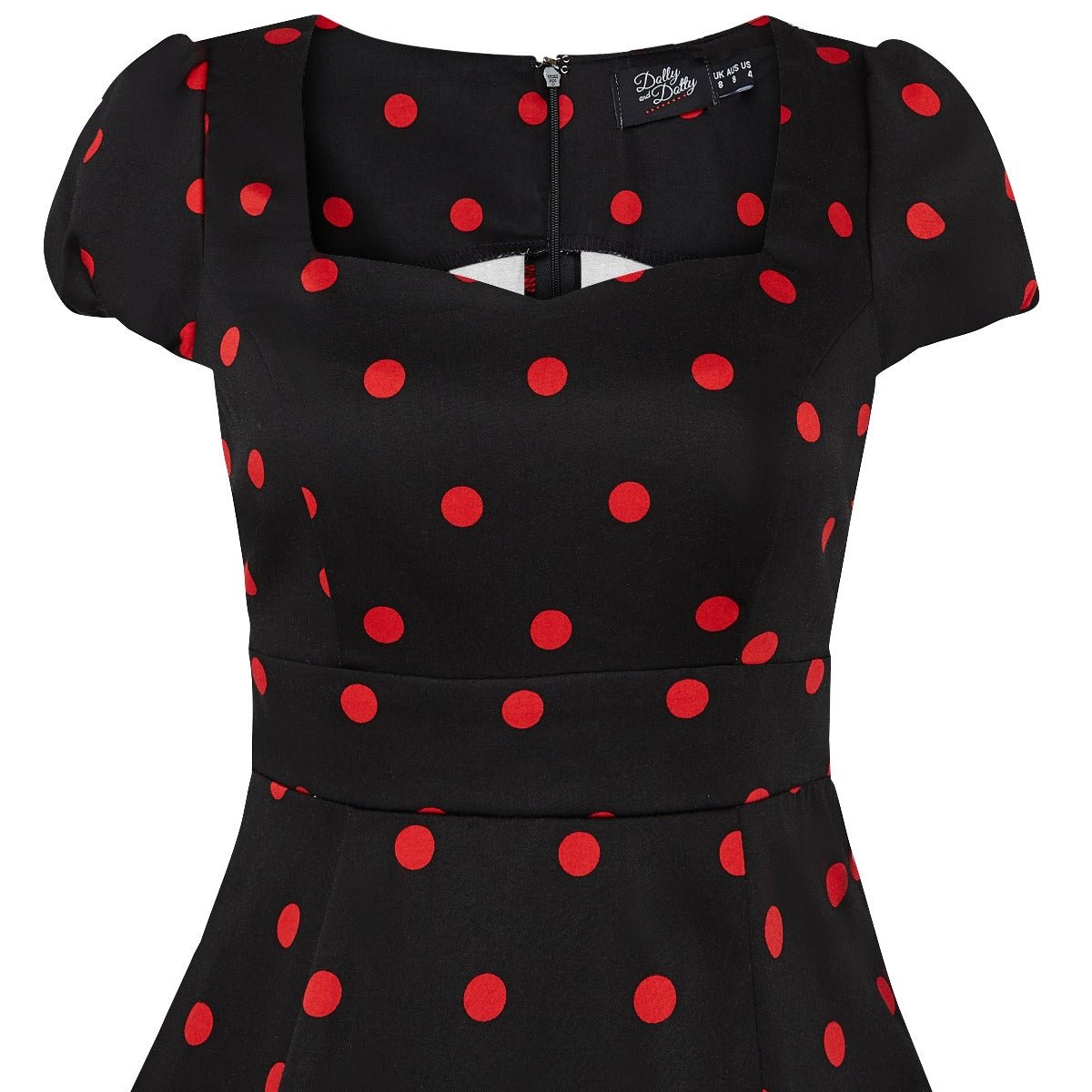 Claudia cap sleeve dress in black, with red polka dots, close up view