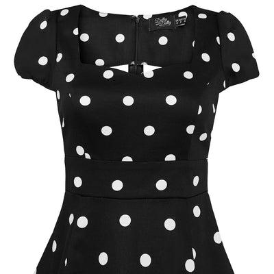 Claudia short sleeve swing dress, in black, with white polka dots, close up view