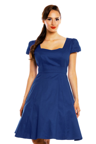 Model wearing a plain dark blue dress close up