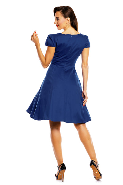 Model wearing a plain dark blue dress back view