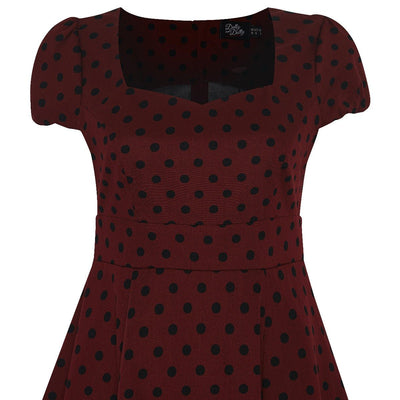 Burgundy dress with black polka dots close up