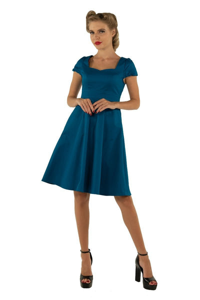 Model wearing plain teal blue 50's dress