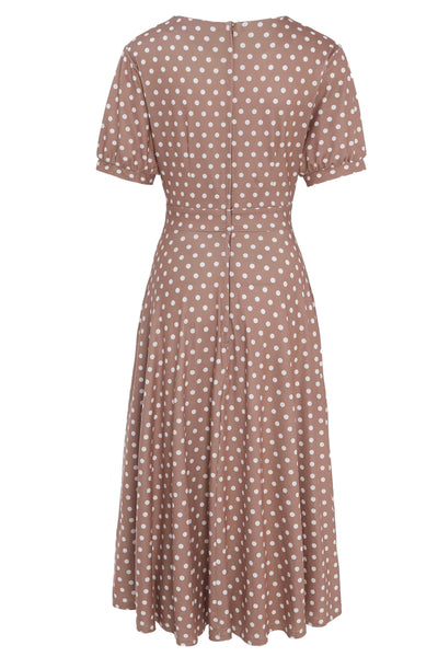 Back view of 50s style brown and white polka dot swing dress