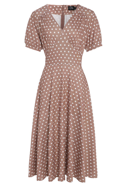 Front view of 50s style brown and white polka dot swing dress