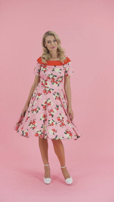 Video of model wearing our Darlene Pink with Strawberry print flared dress.