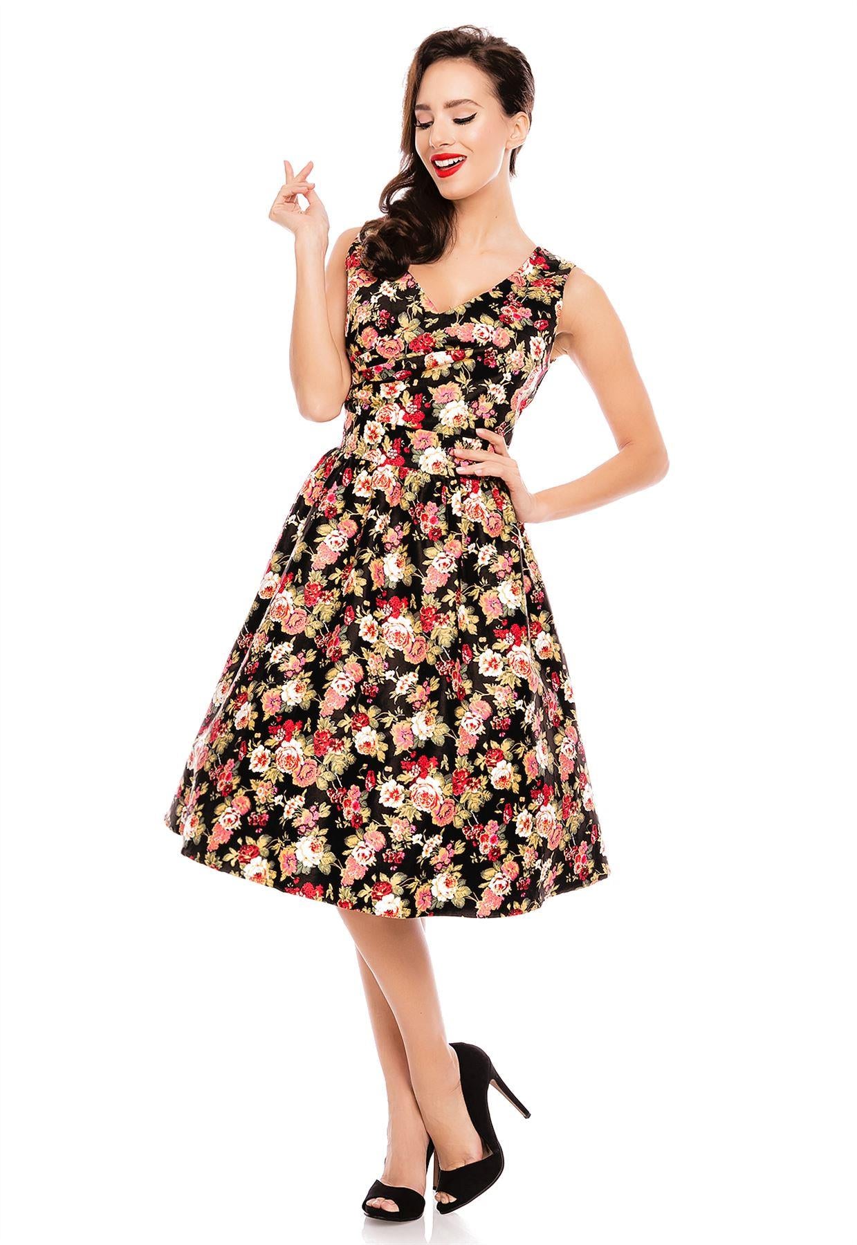 Model wearing our crossover bust May dress, in black/pink floral print, front view