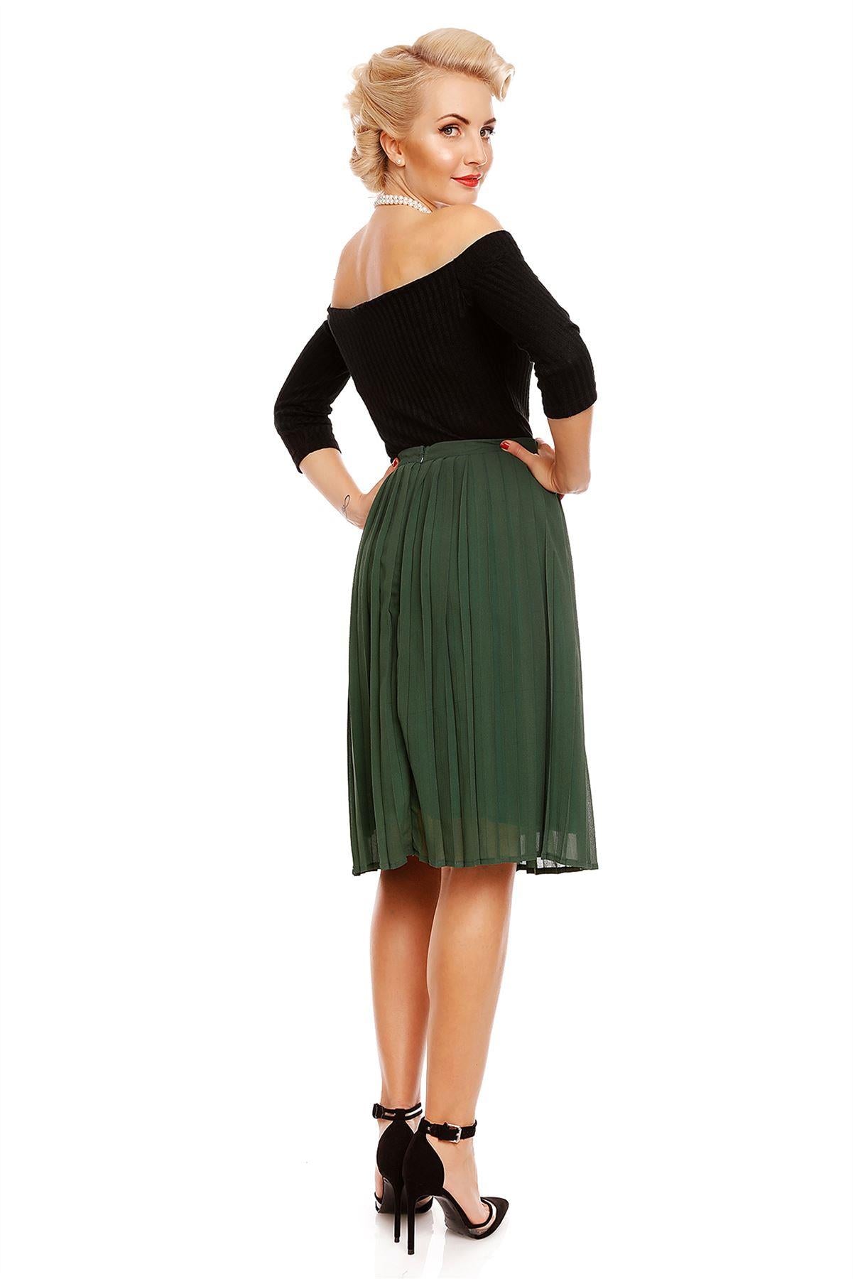 Model wearing our Gloria off-shoulder long sleeve top in black, with a green skirt, back view