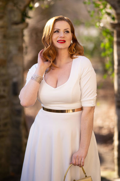A model wearing Women's Bridal White Long Sleeved Midi Dress 
