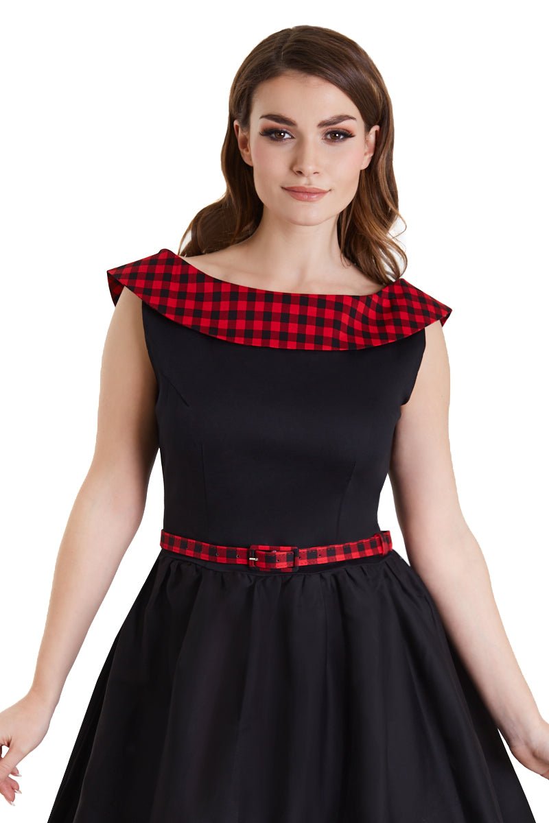 Model wearing black swing dress with red tartan 50's roll collar close up