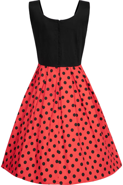 Sleeveless Amanda dress, with black top and red skirt, with black polka dot spots, back view