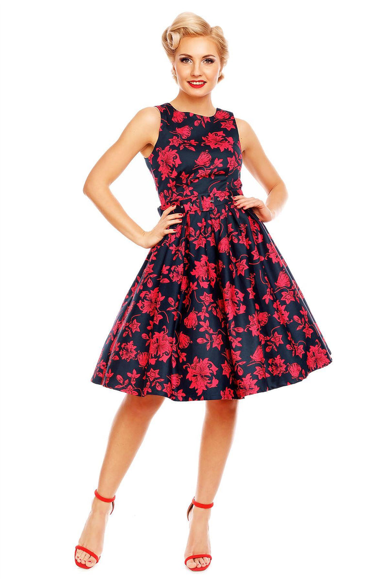Model wearing Retro Swing Dress in Navy Blue/Red floral print, front view