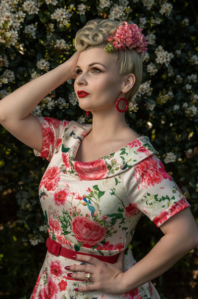 Influencer wearing white and pink floral vintage dress close up