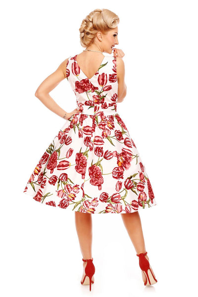 Model wearing our V neck May dress, in white, with pink tulips, back view
