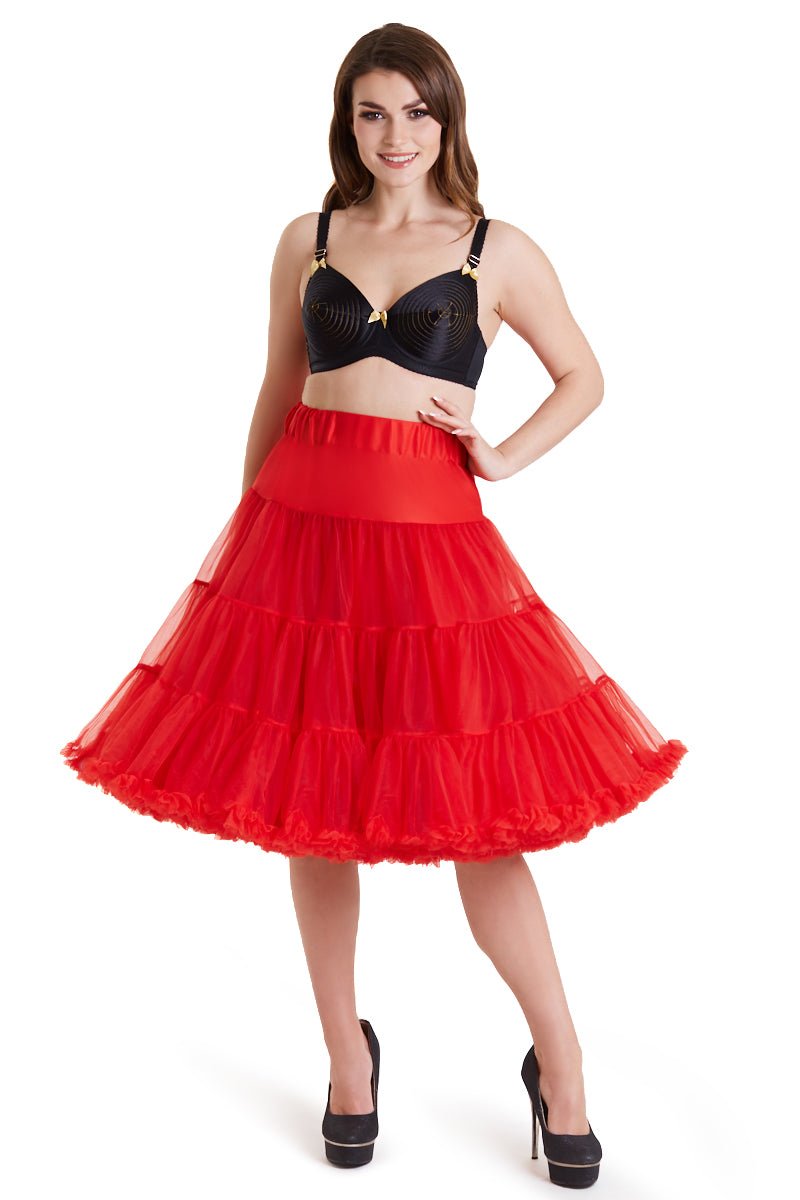 Woman wears a red knee length petticoat, with black accessories