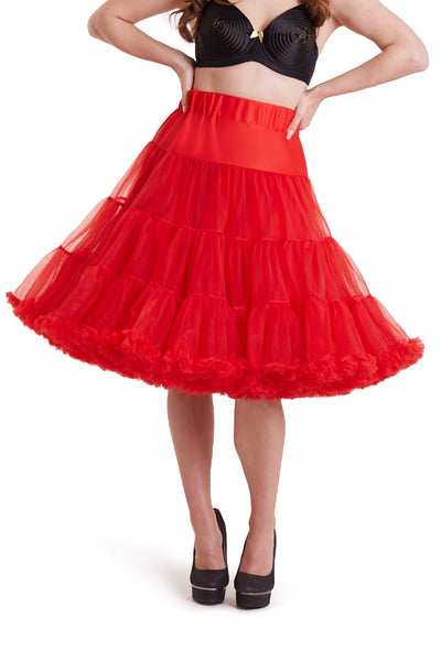 Woman wears a red knee length petticoat, with black accessories