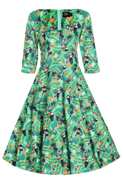 Front view of our half sleeved flared dress in green leaves, pineapples and toucan print