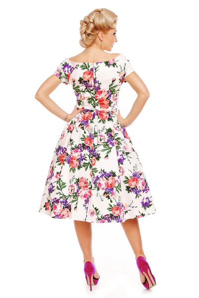 Model wearing our Lily, off-shoulder 50's Evening Dress in White, with pink and purple flowers, back view