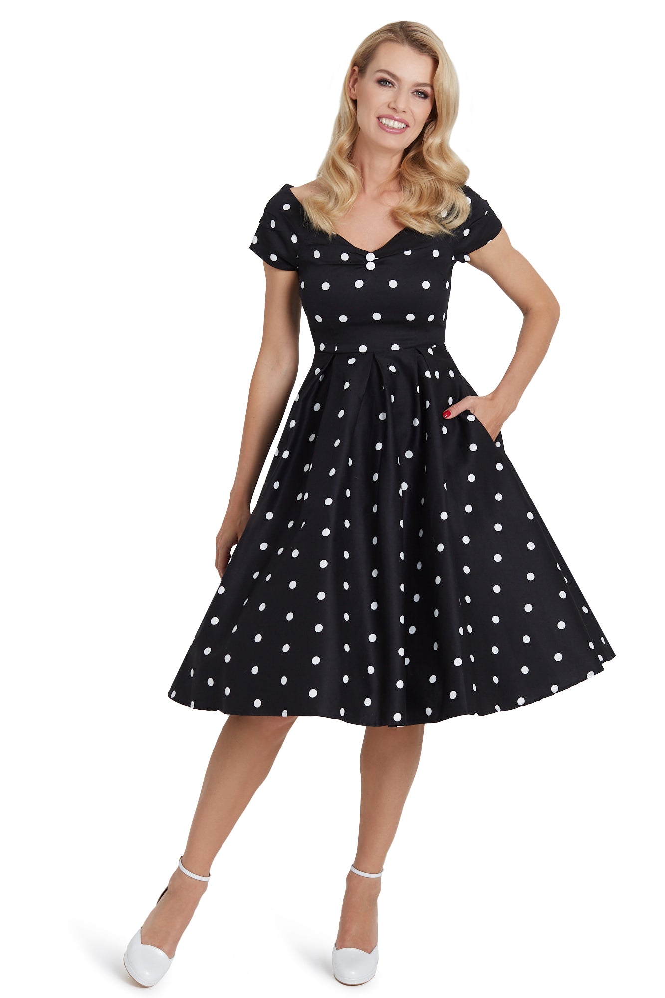 A model wearing Off Shoulder Polka Dot Full Circle Dress in Black & White