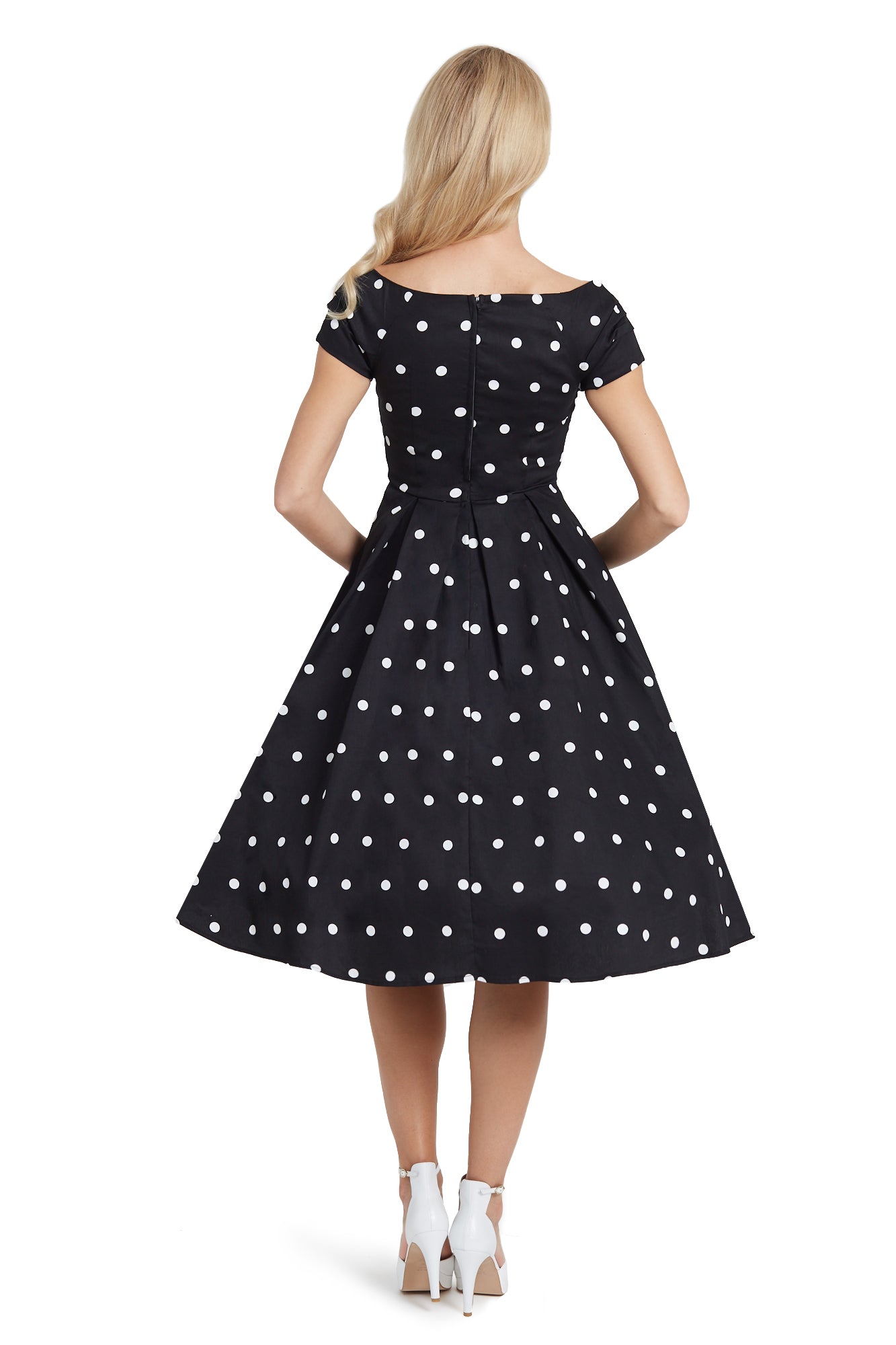 A model wearing Off Shoulder Polka Dot Full Circle Dress in Black & White