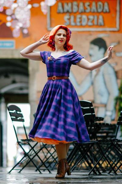 Influencer wearing purple tartan check swing dress with petticoat