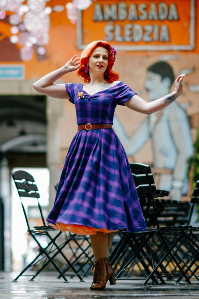 Influencer wearing purple tartan check swing dress with petticoat