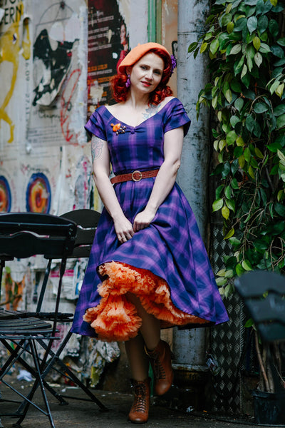 Influencer wearing purple tartan check swing dress with petticoat