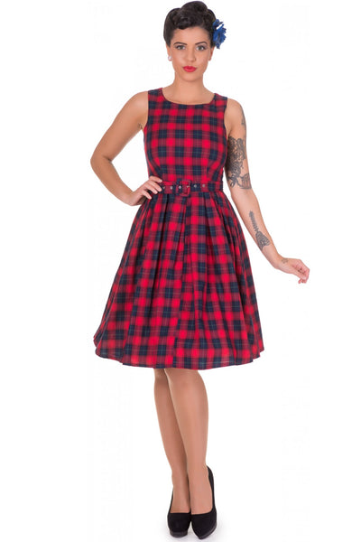Model wears our sleeveless Annie dress in red, with blue checks, front view