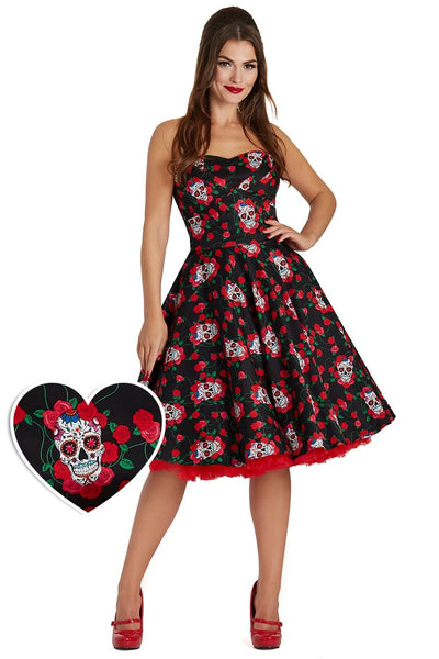 Model wearing the strapless Melissa dress, in black, with red roses and white sugar skulls, front view