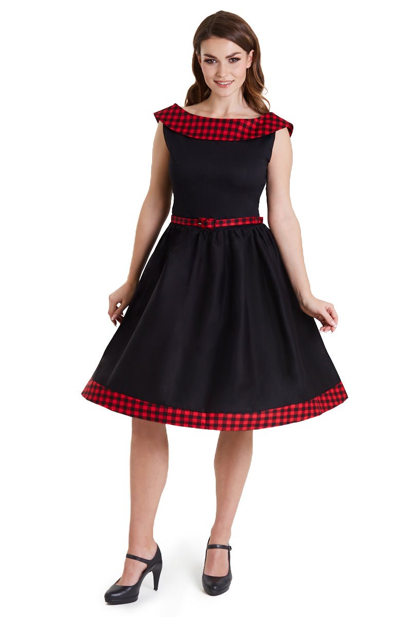Model wearing black swing dress with red tartan 50's roll collar
