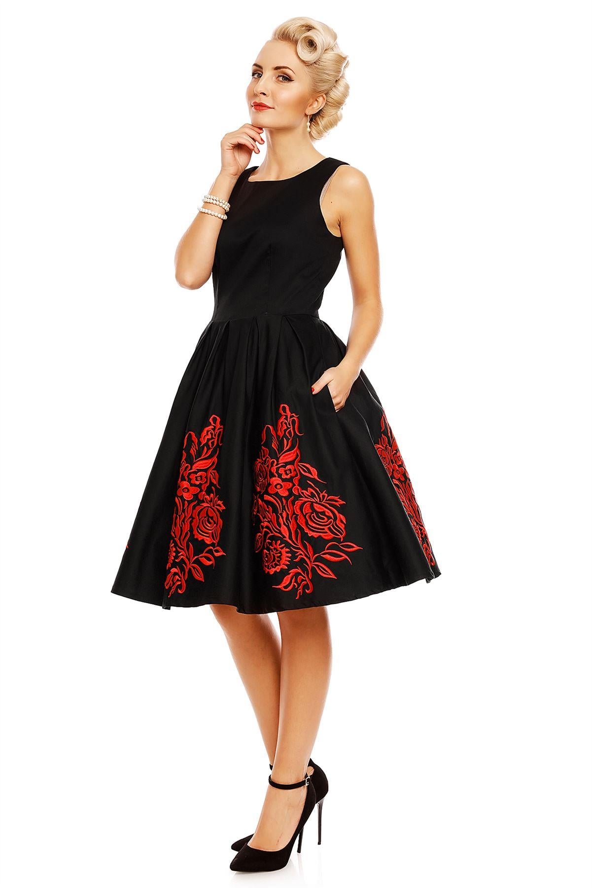 Model wearing Annie Embroidered Roses Swing Dress in Black/Red, side view