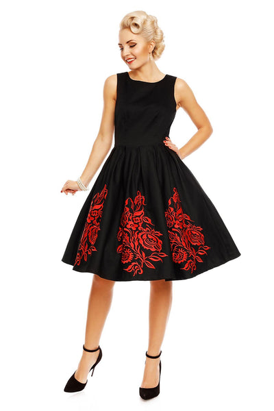 Model wearing Annie Embroidered Roses Swing Dress in Black/Red, front view