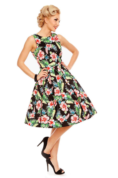Model wearing our Annie dress, in black/pink orchid floral print, side view