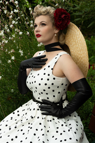 A model wearing Scoop Neck Polka Dot Swing Dress in White-Black