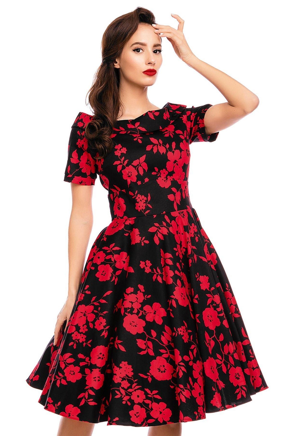 Model wearing our bateau neckline Darlene dress, in black/red floral print, close up view