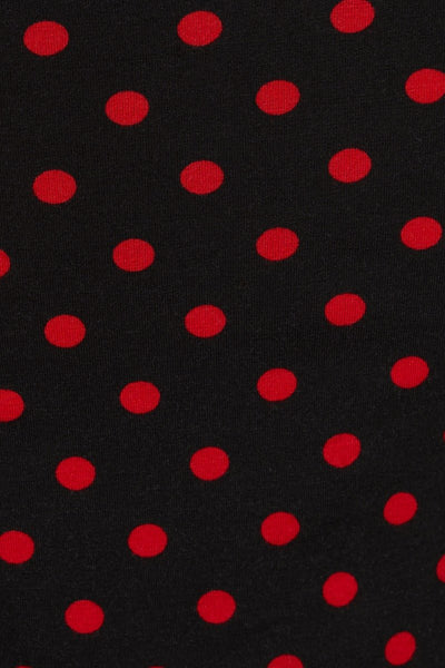 fabric close up, black, with red polka dots