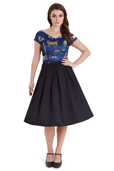 Model wears our V neck, short sleeved top, in dark blue, with cats print, front view
