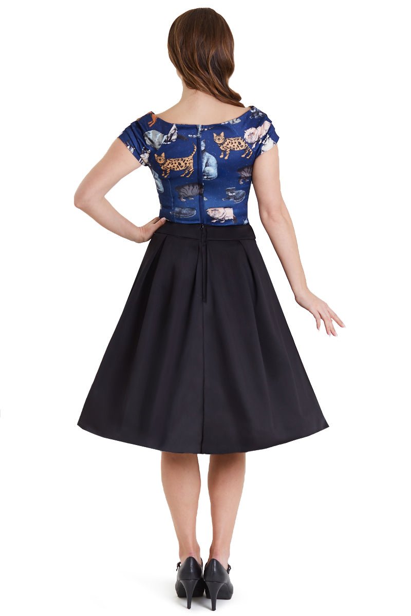 Model wears our V neck, short sleeved top, in dark blue, with cats print, back view