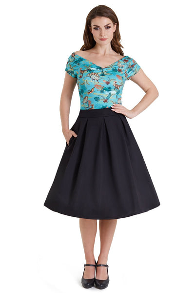 Model wearing blue dinosaur/pterosaur print top, with a black skirt