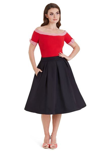 Model in red off shoulder top with short sleeves